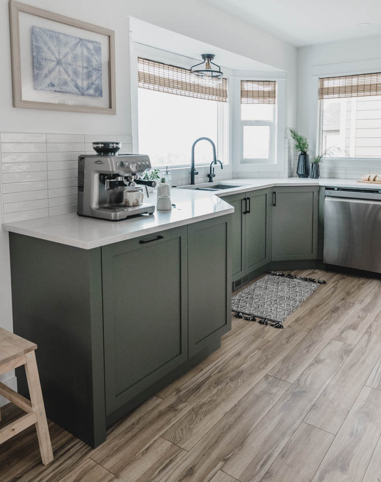 Kitchen cabinets in a bay window- love this layout