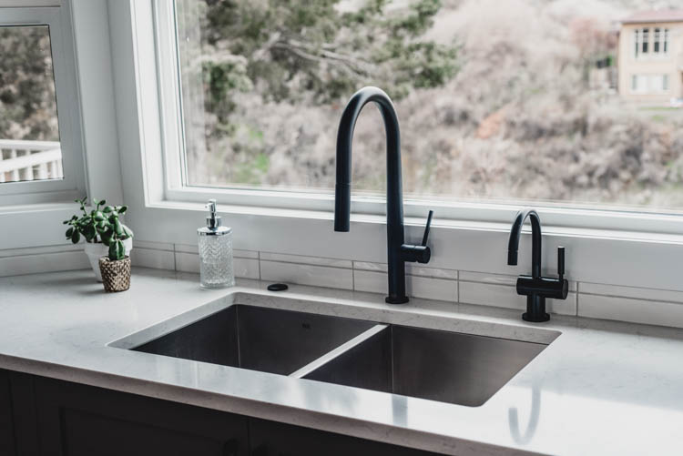 I thought a hot water dispenser and faucet and garbage disposal switch would look crowded, but it's all so sleek and beautiful