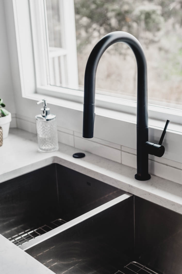 Matte black kitchen faucet with matching garbage disposal switch