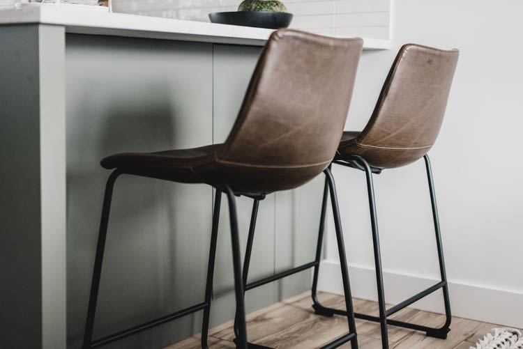 Modern leather stools for a green kitchen