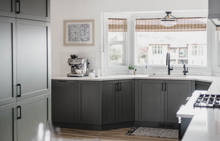 A kitchen tour with olive green cabinets and black hardware 