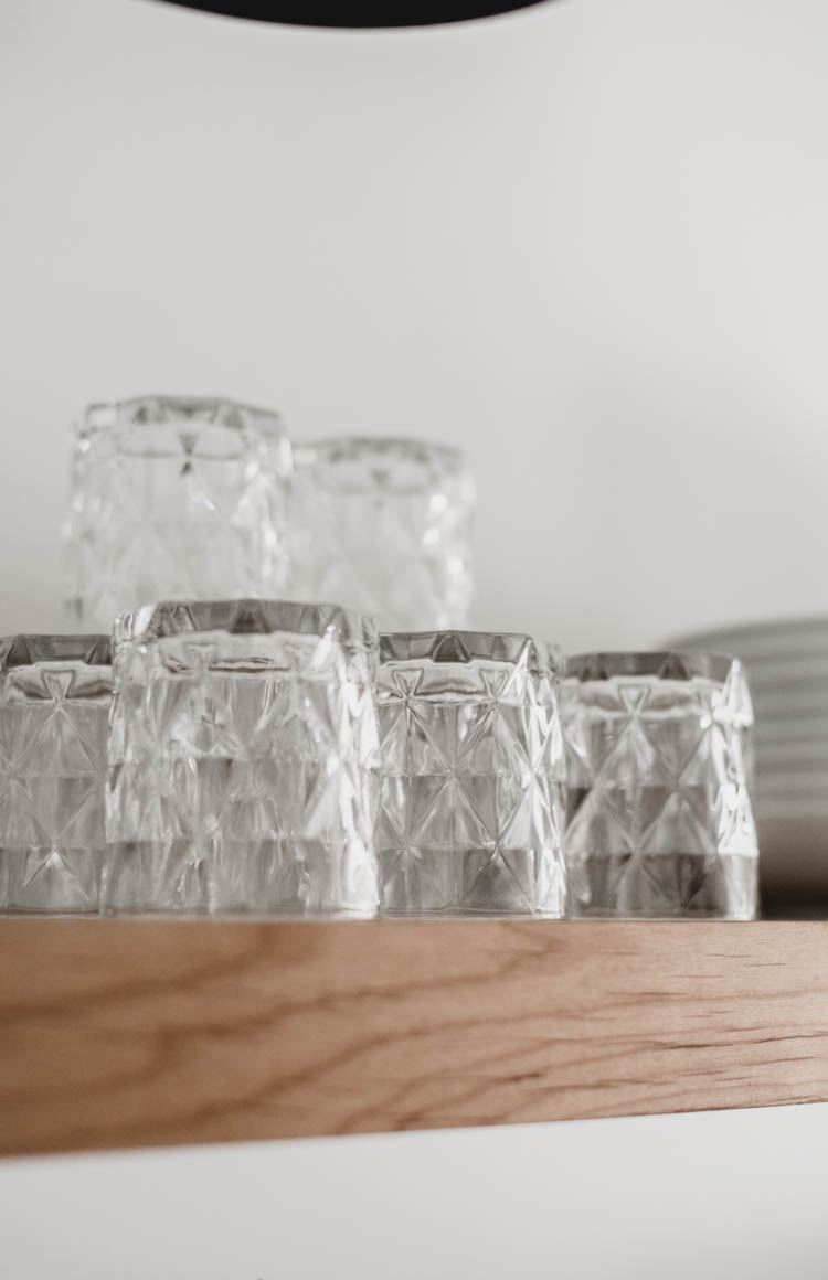 Stacking glassware on open shelving to add height