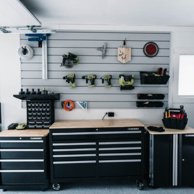I love this for a small garage turned workshop while still having great storage! Garage Workshop Transformation - before and after + details