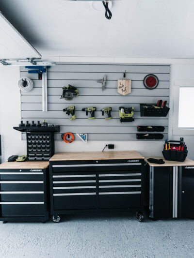 I love this for a small garage turned workshop while still having great storage! Garage Workshop Transformation - before and after + details