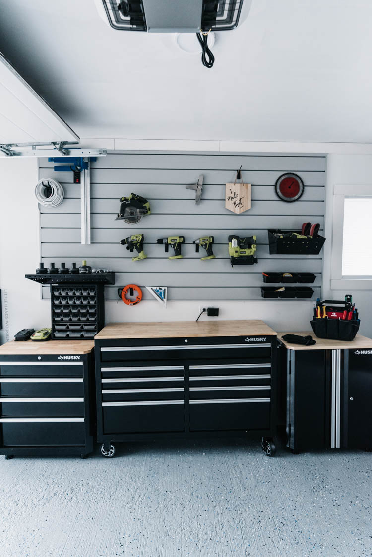 I love this for a small garage turned workshop while still having great storage! Garage Workshop Transformation - before and after + details
