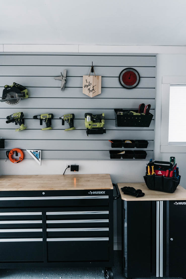 I love this for a small garage turned workshop while still having great storage! Garage Workshop Transformation - before and after + details
