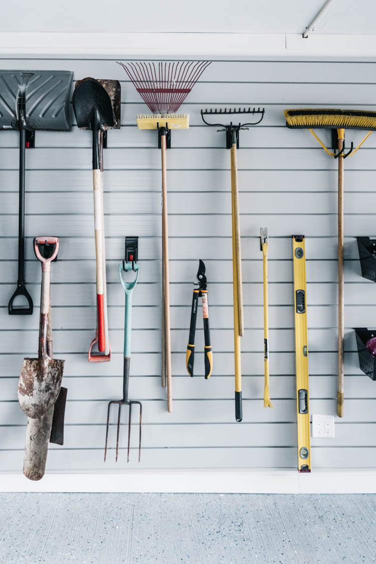 Yard tool storage in a garage