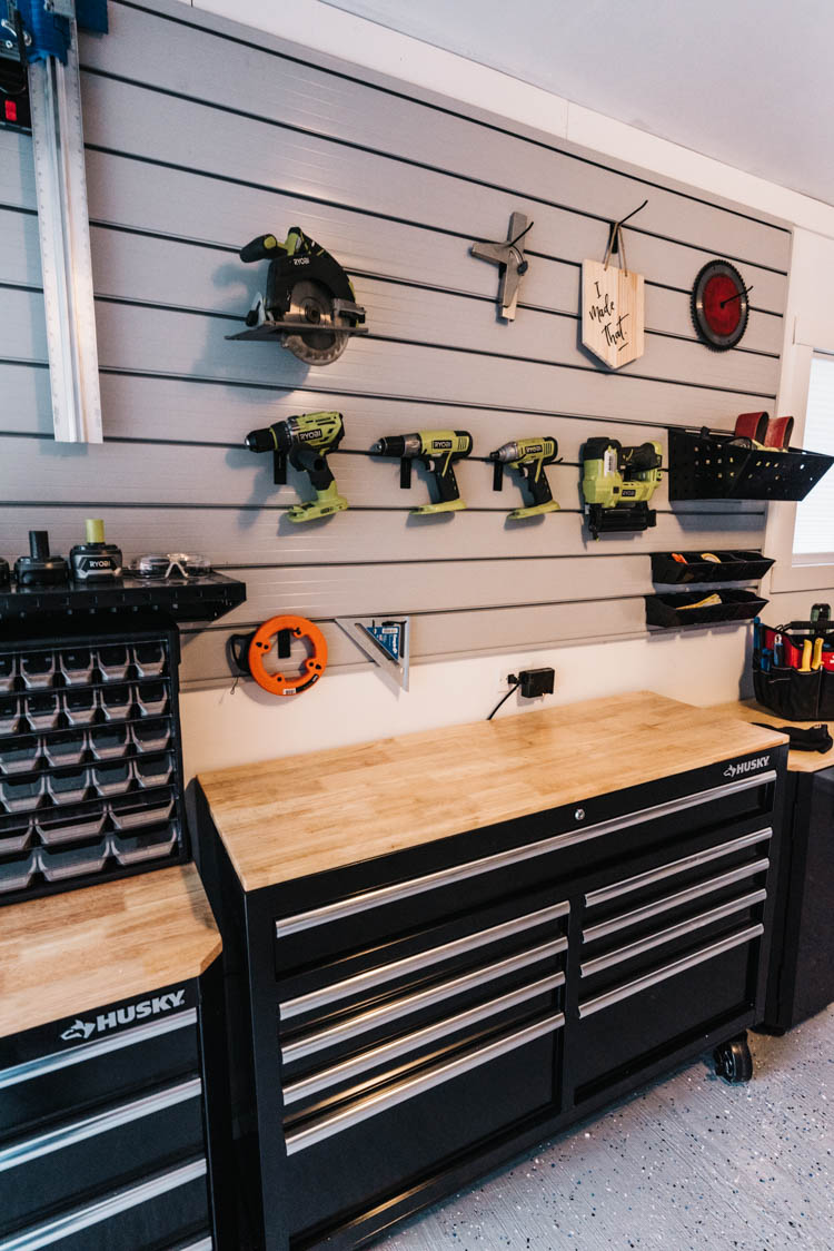 Garage track wall for tool storage