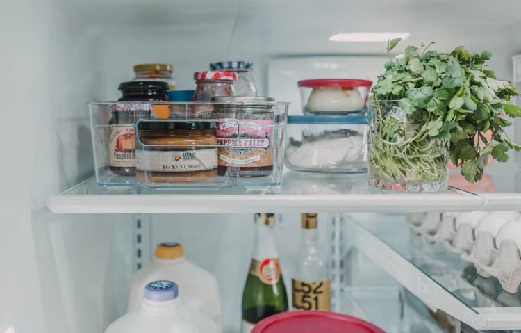 Corral all leaky jars into one basket in the fridge