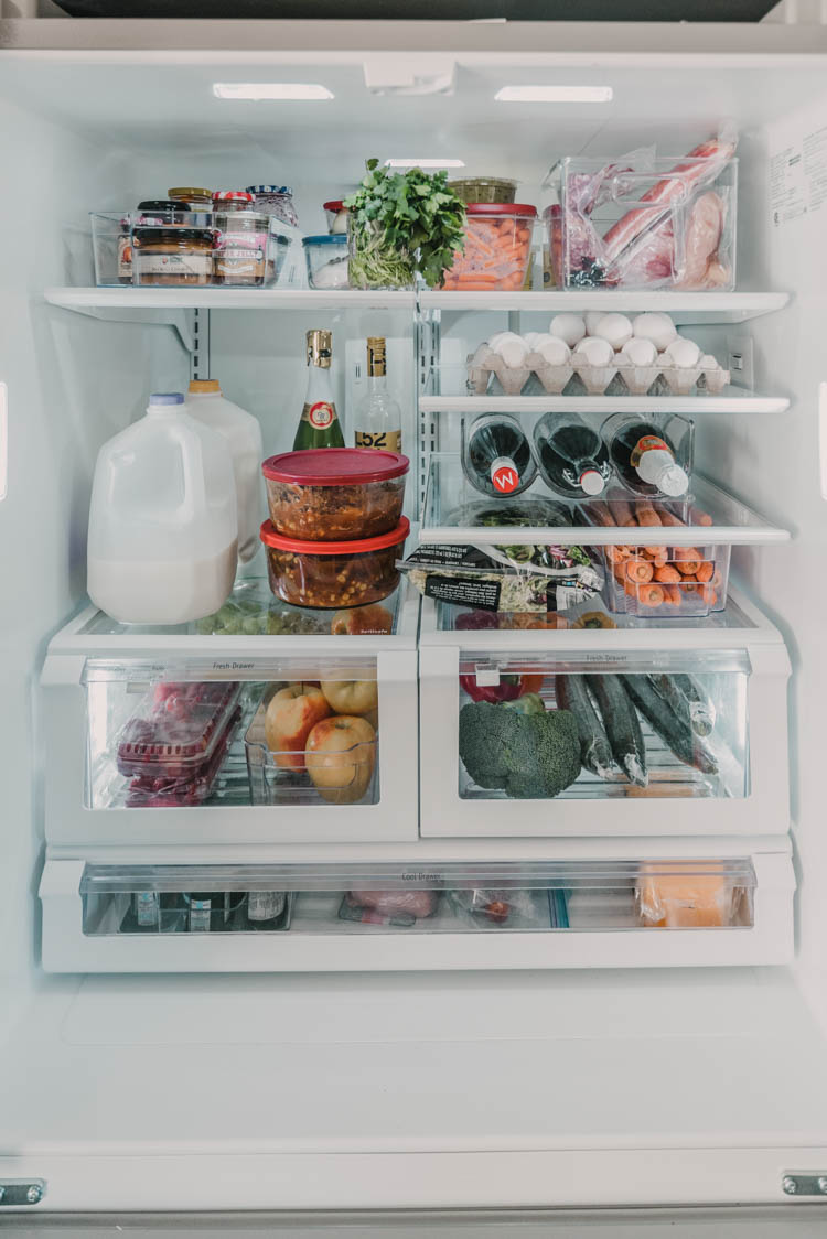 Fridge organization tips for families (love the use of the door storage)