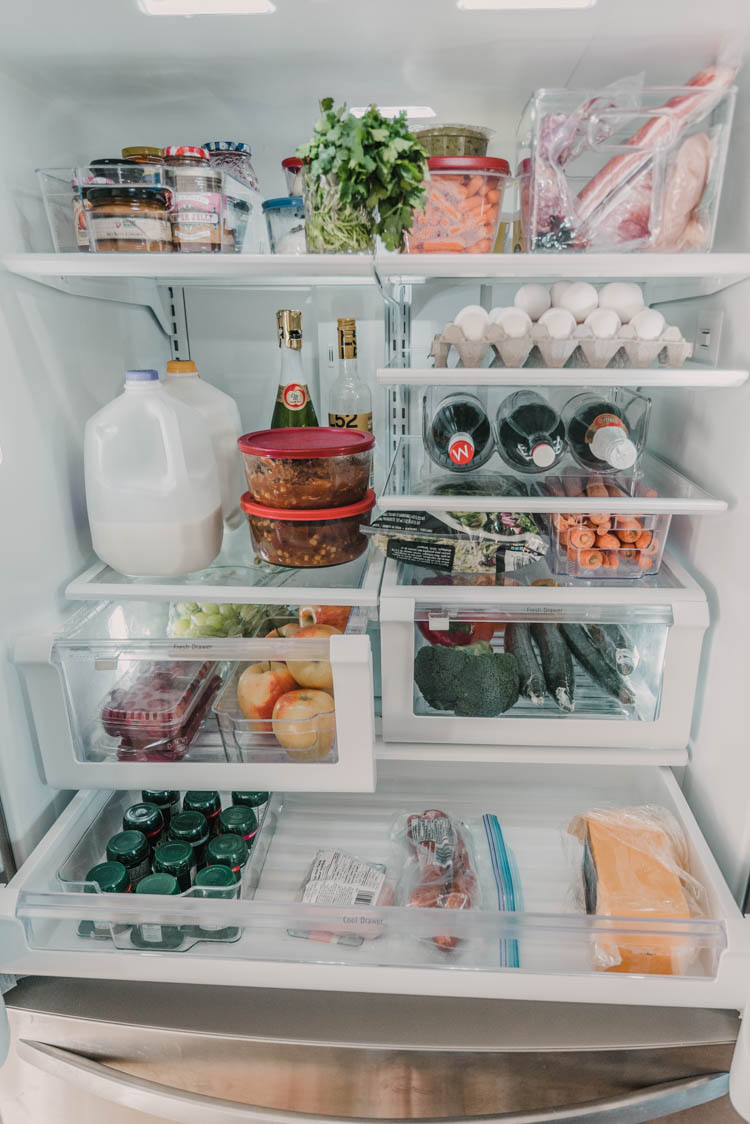 Fridge organization tips for families (love the use of the door storage)