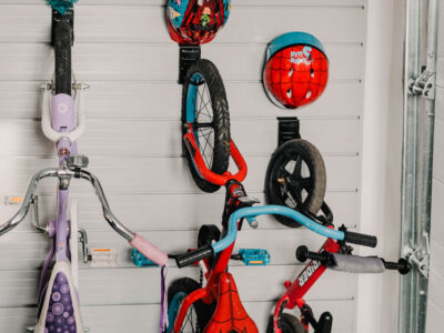 The best way to store kids bikes! Bike hooks with small hooks for helmet- slat wall storage