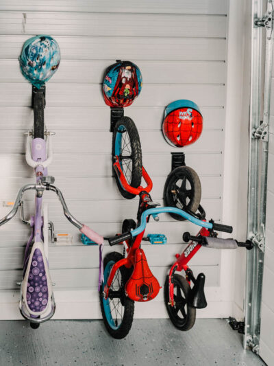 The best way to store kids bikes! Bike hooks with small hooks for helmet- slat wall storage