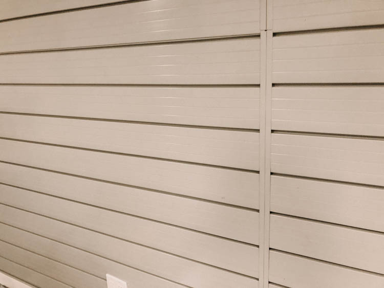 Four panels of slat wall for one mega storage wall in the garage