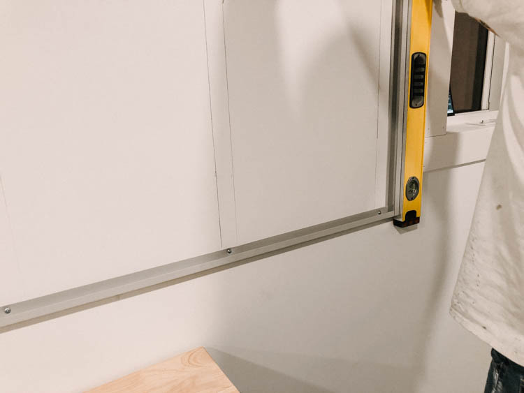 Install the bottom edge of slat wall first