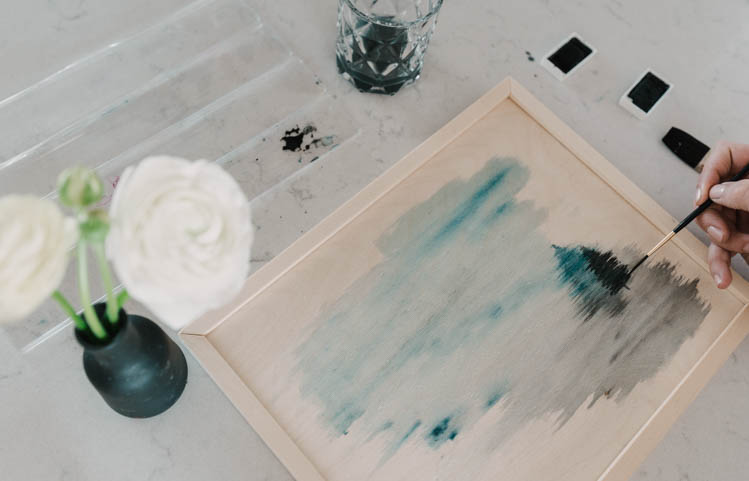 Adding trees to a watercolor wash for a foggy trees painting