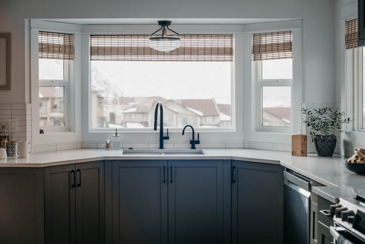 green cabinets with wood shades