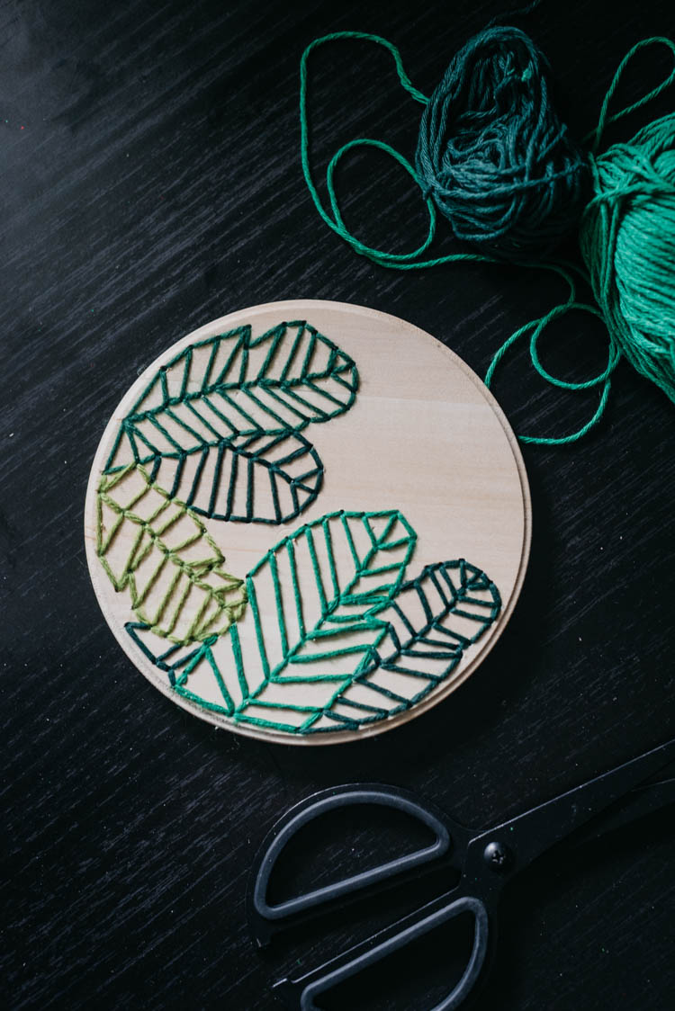 How to embroider on wood- love this modern take on a botanical embroidery hoop!