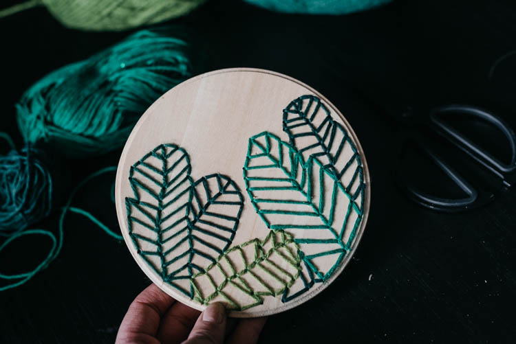 How to embroider on wood- love this modern take on a botanical embroidery hoop!