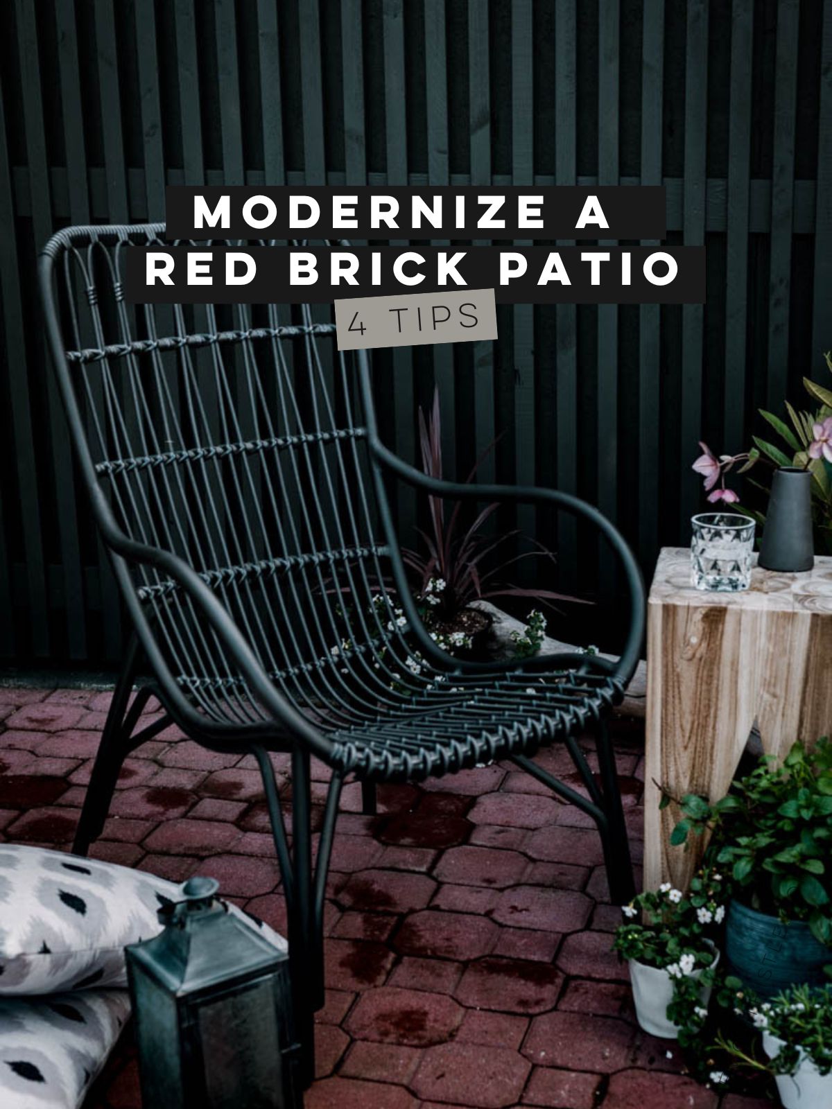 modernize a red brick patio (text over image of brick patio with dark and moody decor)