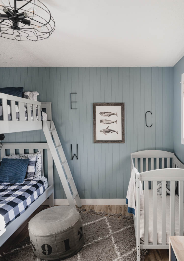 Nordic Industrial Boys Bedroom shot of the headboard wall with bunk beds and crib