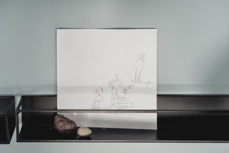 Open shelves to display kids artwork and collections