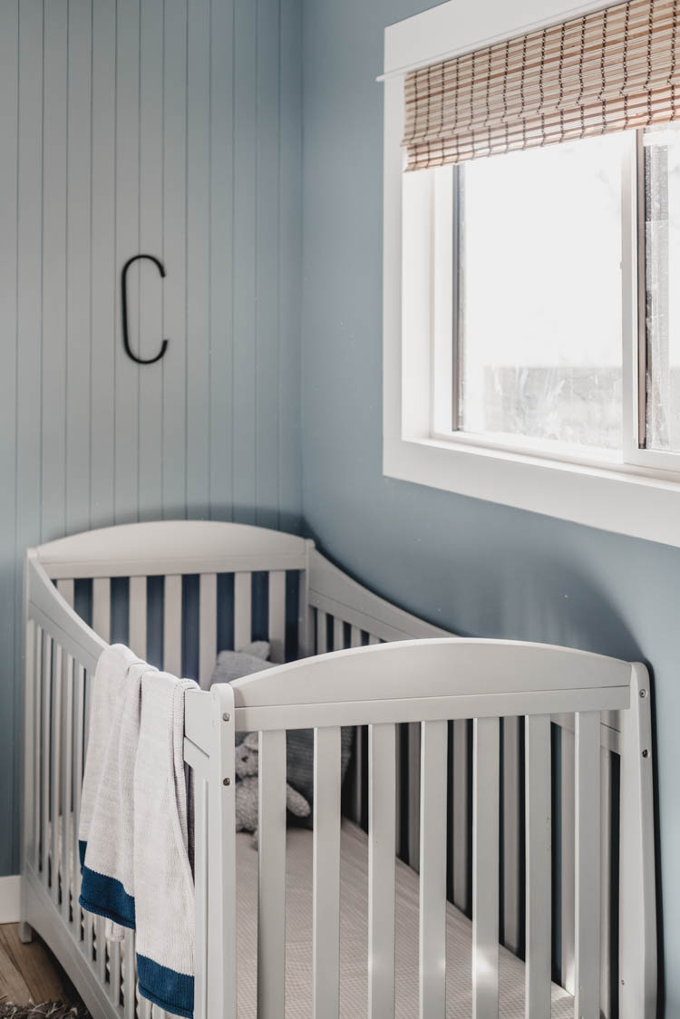crib under window with skinny shiplap and wood shades (faux!)