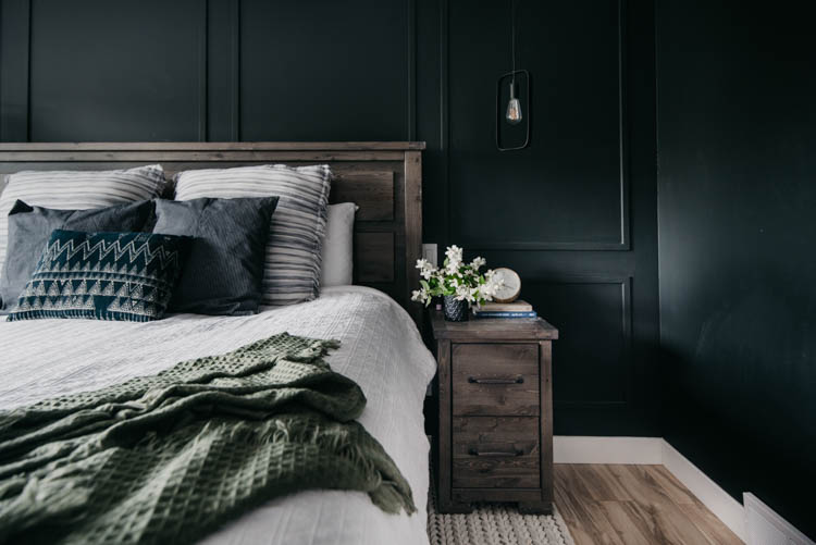 paneled moulding wall detail - black walls with hanging pendants in bedroom... love this moody room!