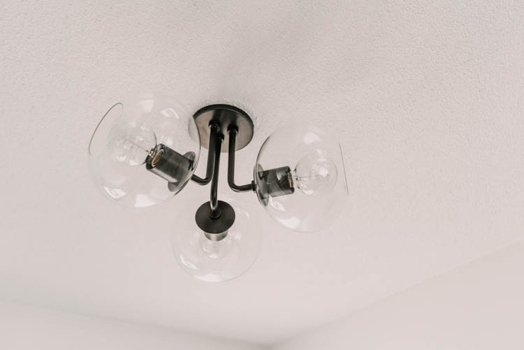 Modern semi flush mount light fixture- love the three glass globes on this one!