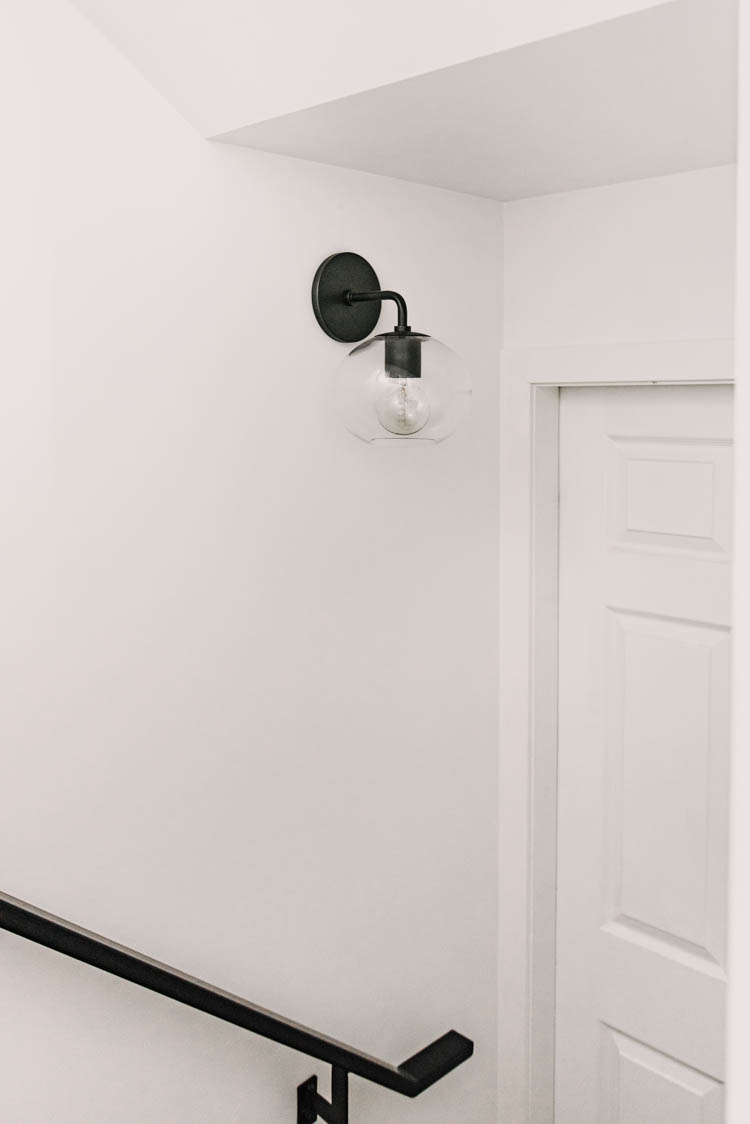 Love this light and railing to modernize a stairway