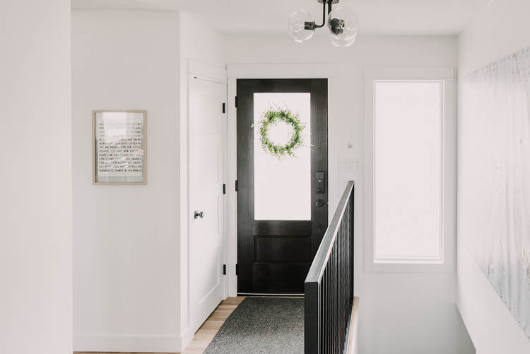 Modern Entry Way Makeover with new door, railing, and flooring