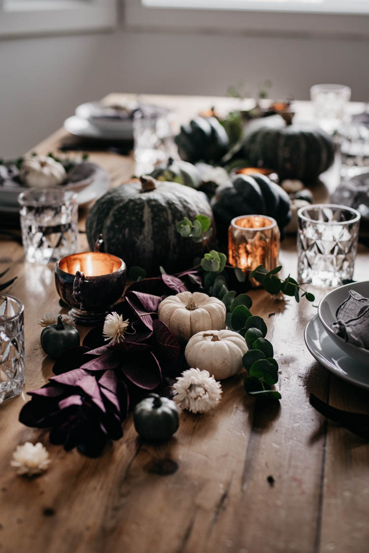 Moody Autumn Tablescape with foliage and pumpkins