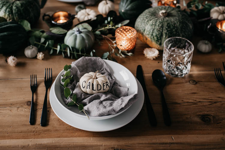 Hand Lettered mini pumpkins for place cards at a thanksgiving table