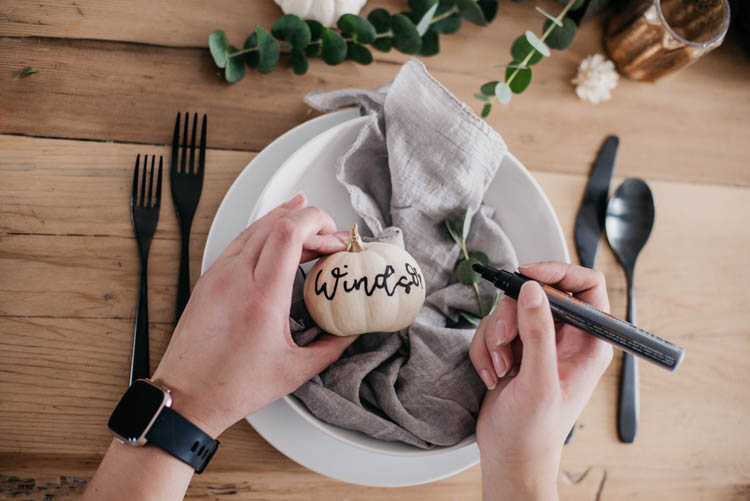 Hand Lettered mini pumpkins for place cards at a thanksgiving table
