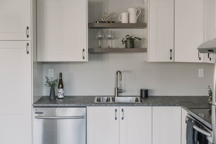 Simple open shelving over the sink in a kitchen (basement kitchen!)