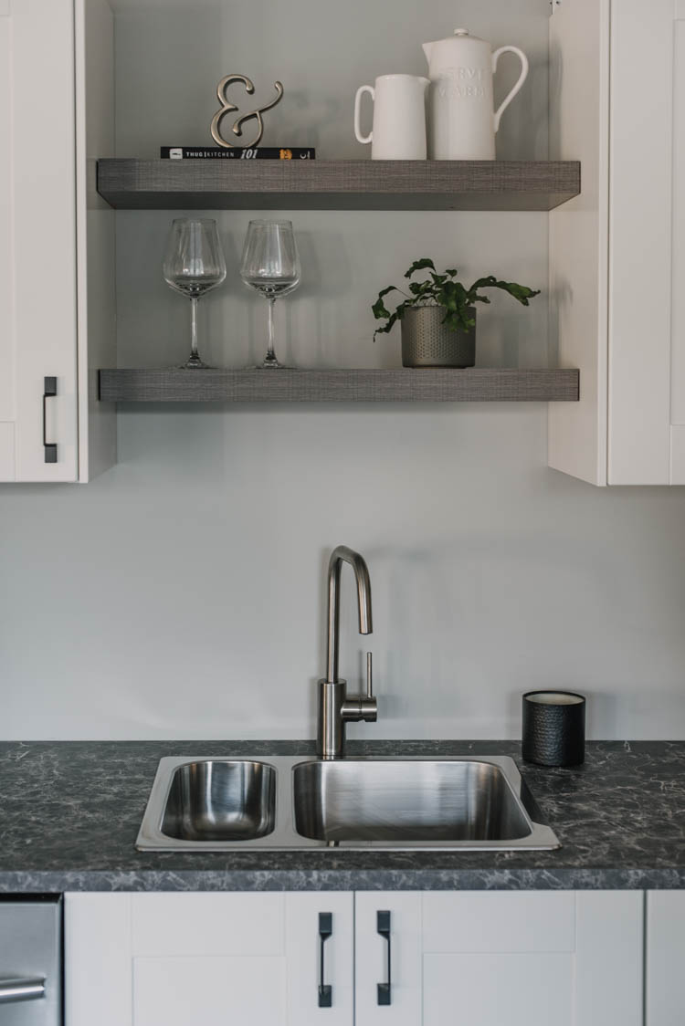 Simple open shelving over the sink in a kitchen (basement kitchen!)