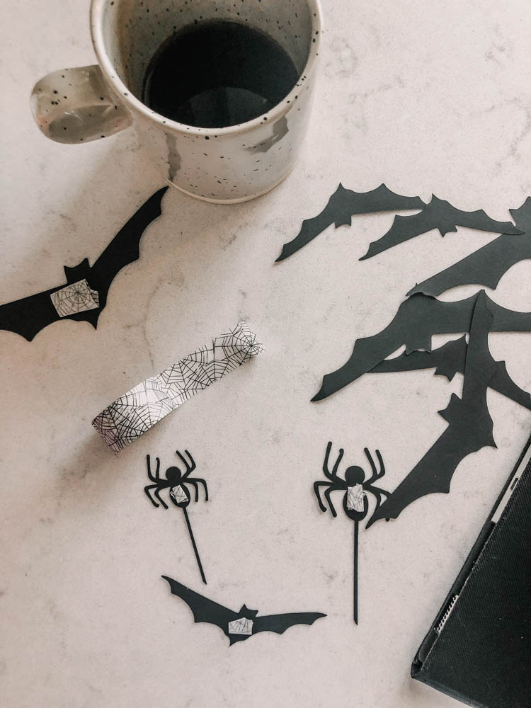 Cutting bats and spiders for halloween decor