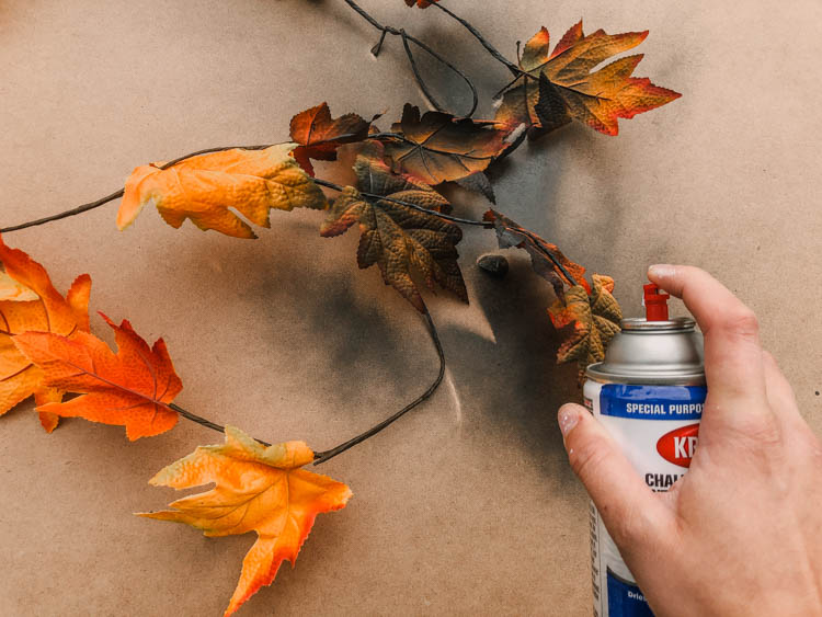 Transforming dollar store garlands into halloween decorations with spray paint