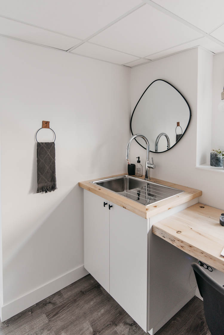 Sink corner in a basement office- perfect for water refills and paintbrush washing