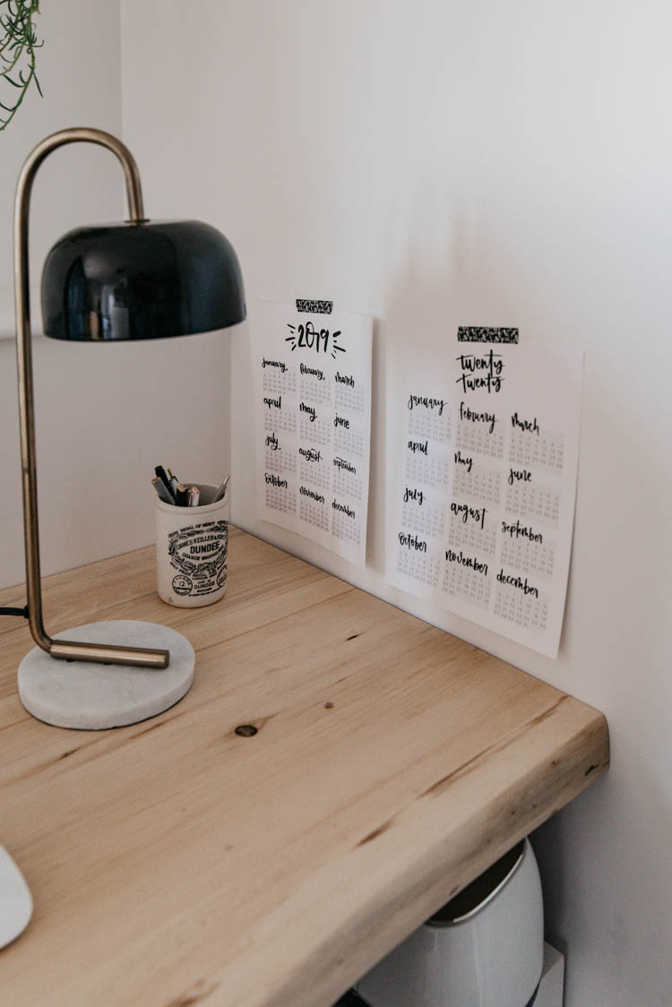 year at a glance calendars beside the computer for easy reference (free printables)