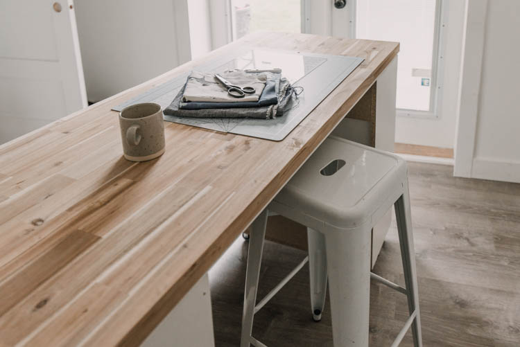 DIY Rolling craft table made from affordable kitchen cabinets!
