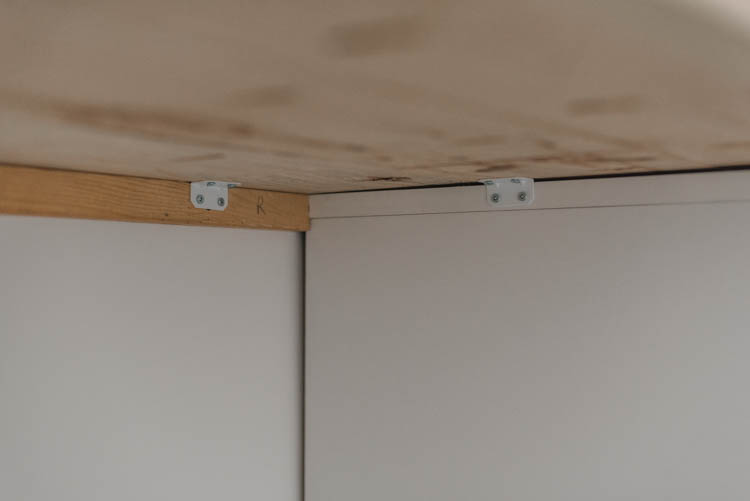 L brackets to hold floating desk in place