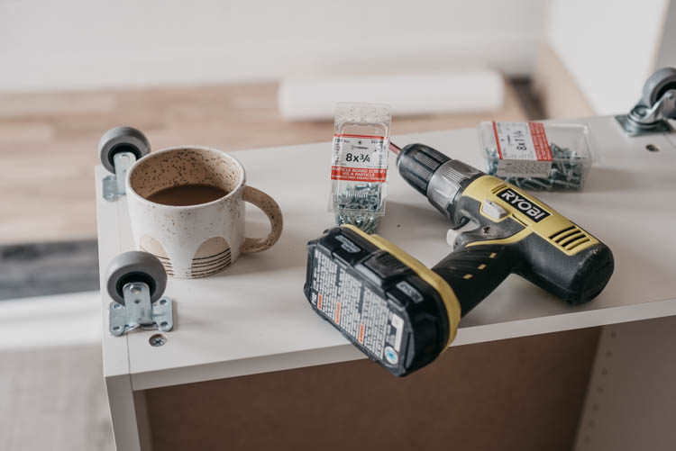 DIY Rolling craft table made from affordable kitchen cabinets!