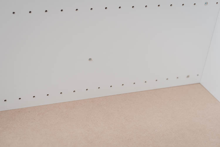 DIY Rolling craft table made from affordable kitchen cabinets!
