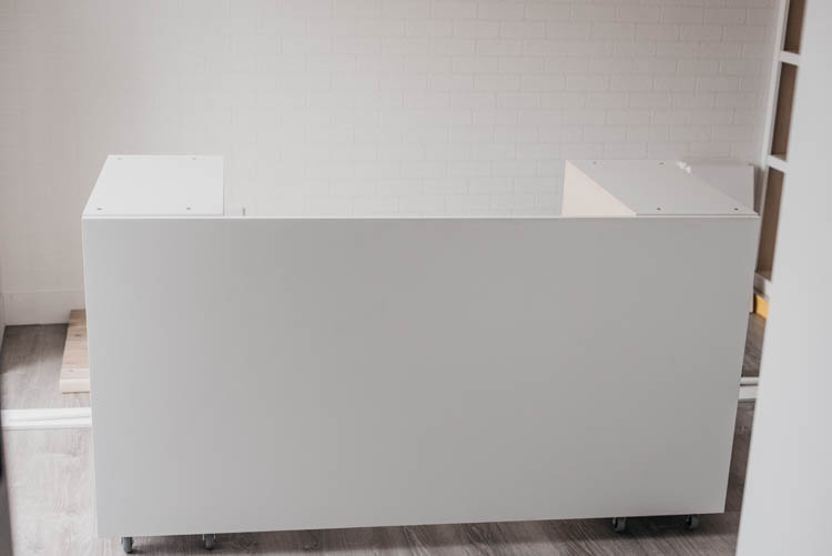 DIY Rolling craft table made from affordable kitchen cabinets!