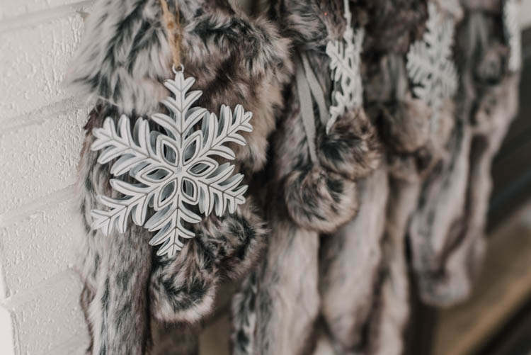 Faux fur stockings with metal snowflake ornaments