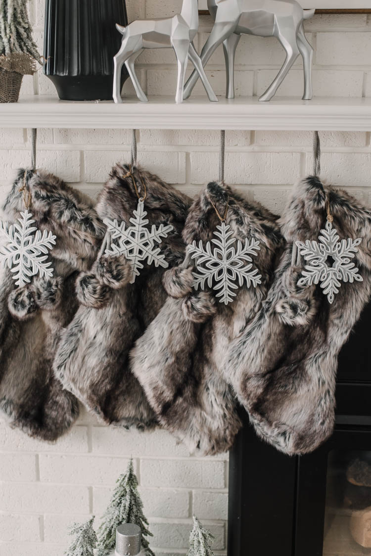 Faux fur stockings with metal snowflake ornaments