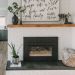 modern rustic diy brick fireplace makeover... love the painted brick, tile hearth and the chunky wood mantel