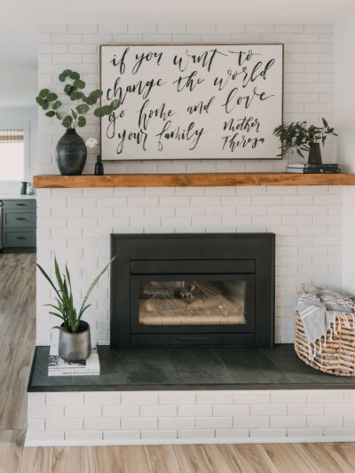 modern rustic diy brick fireplace makeover... love the painted brick, tile hearth and the chunky wood mantel