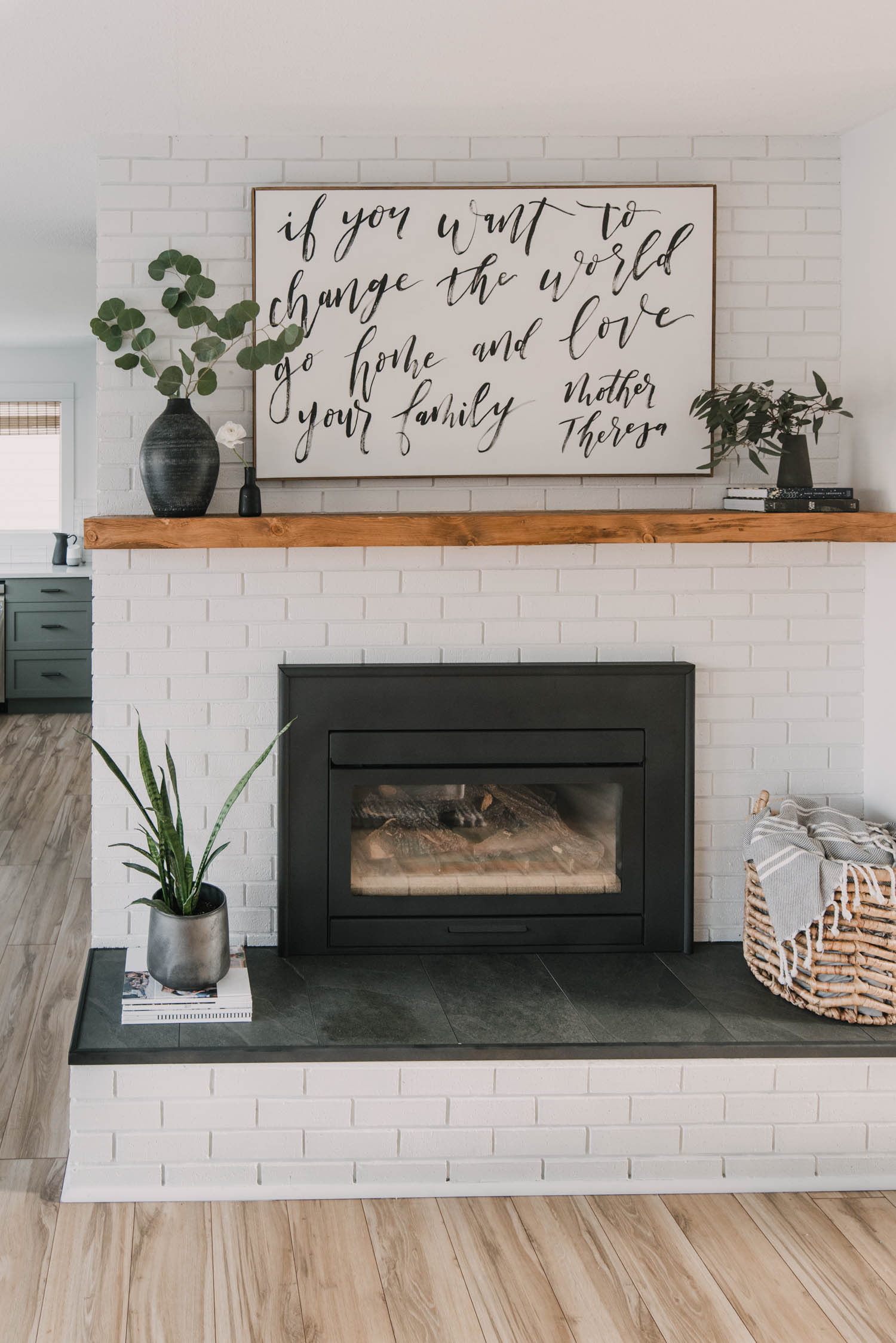 modern rustic diy brick fireplace makeover... love the painted brick, tile hearth and the chunky wood mantel